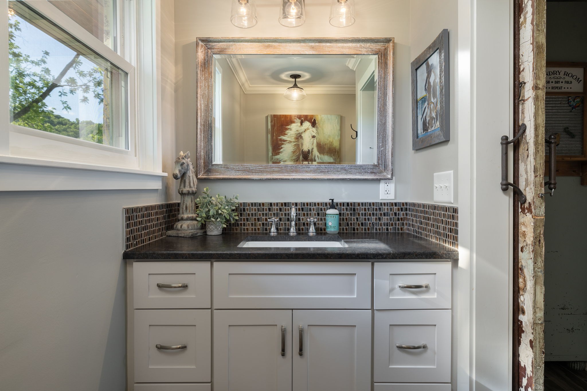 1496 Coleman Road Franklin, TN 37064 - Photo 29 of 73 a sink with a mirror