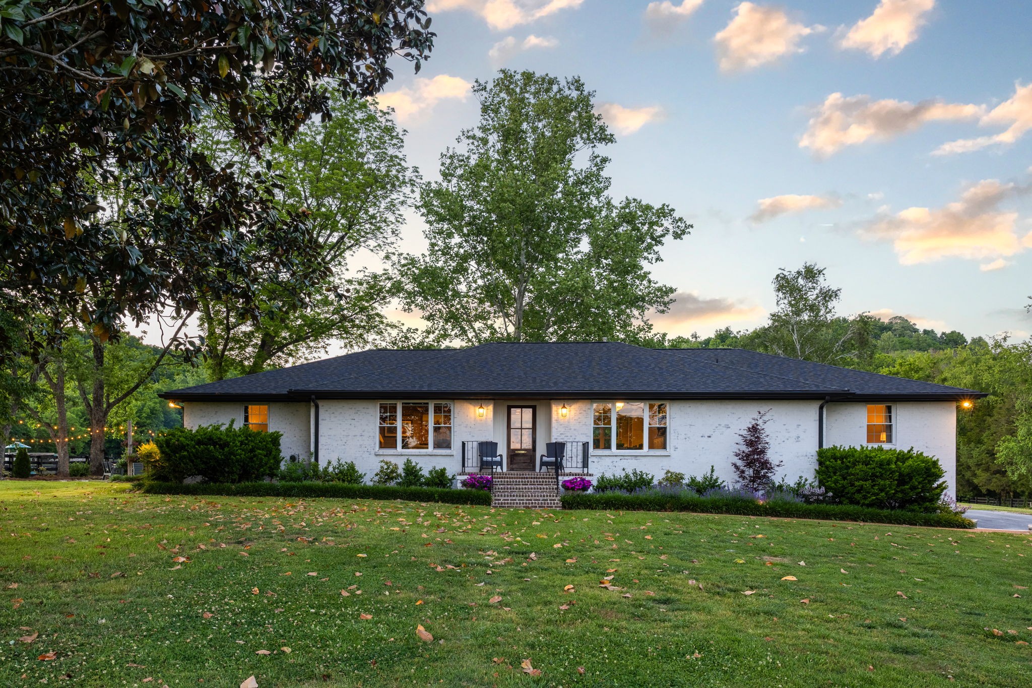 1496 Coleman Road Franklin, TN 37064 - Photo 4 of 73 a front view of a house with garden