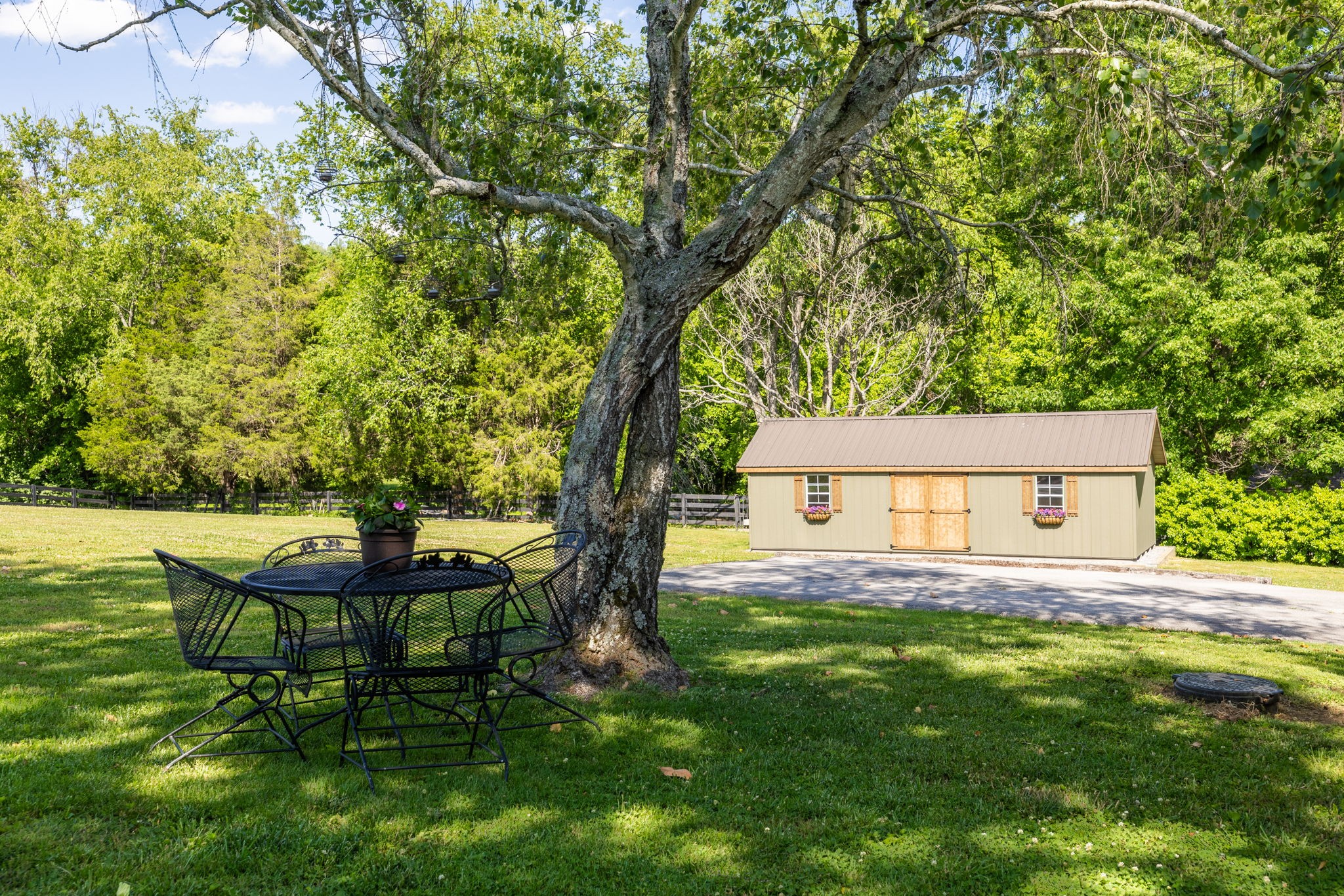 1496 Coleman Road Franklin, TN 37064 - Photo 60 of 73 a backyard of a house with table and chairs