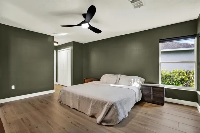 a bedroom with a bed and a window