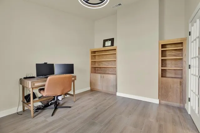 a room with a chair and wooden floor