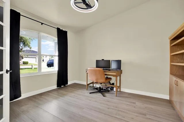 a view of workspace with wooden floor and chair