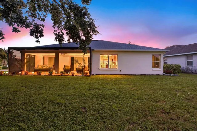 a front view of house with yard and seating area