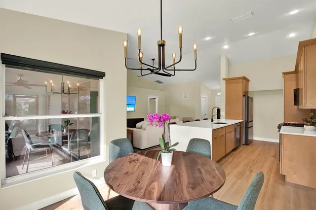 a view of a dining room with furniture window and wooden floor