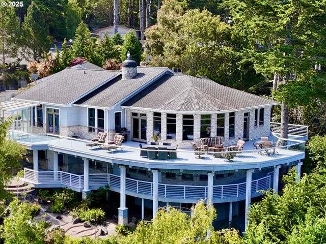 a view of a house with a sitting area and garden view