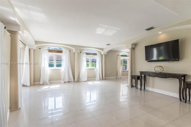 a kitchen with a stove and refrigerator