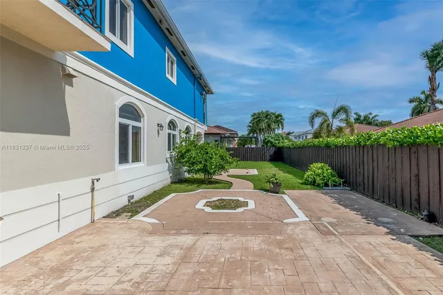 an aerial view of a house with a ocean view