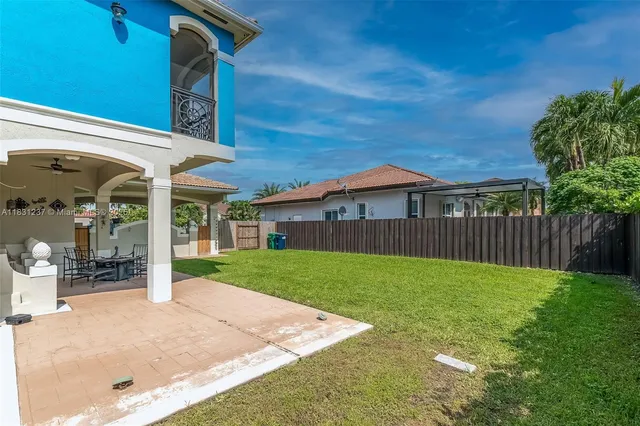 an aerial view of residential building with green space