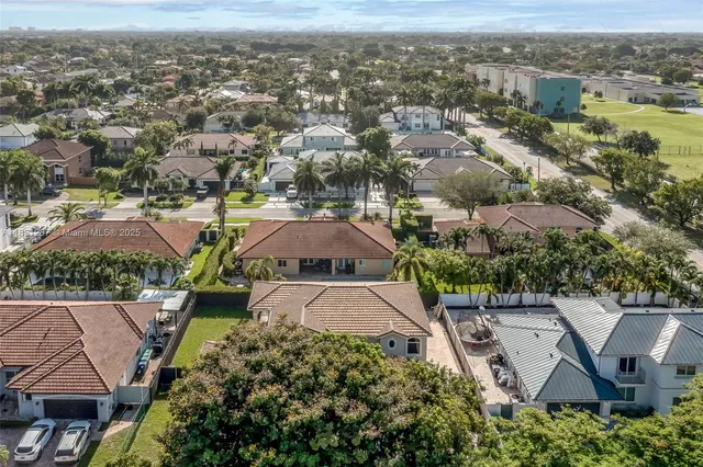 a bedroom with furniture and a flat screen tv