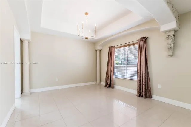 a view of a livingroom with furniture and a flat screen tv