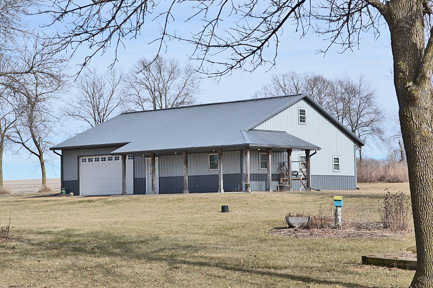6727 Theodorff Road Pecatonica, IL 61063 - Photo 11 of 16 a front view of a house with a yard