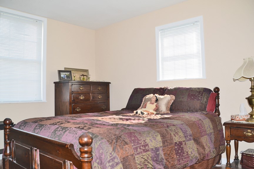 6727 Theodorff Road Pecatonica, IL 61063 - Photo 13 of 16 a bedroom with a bed and window