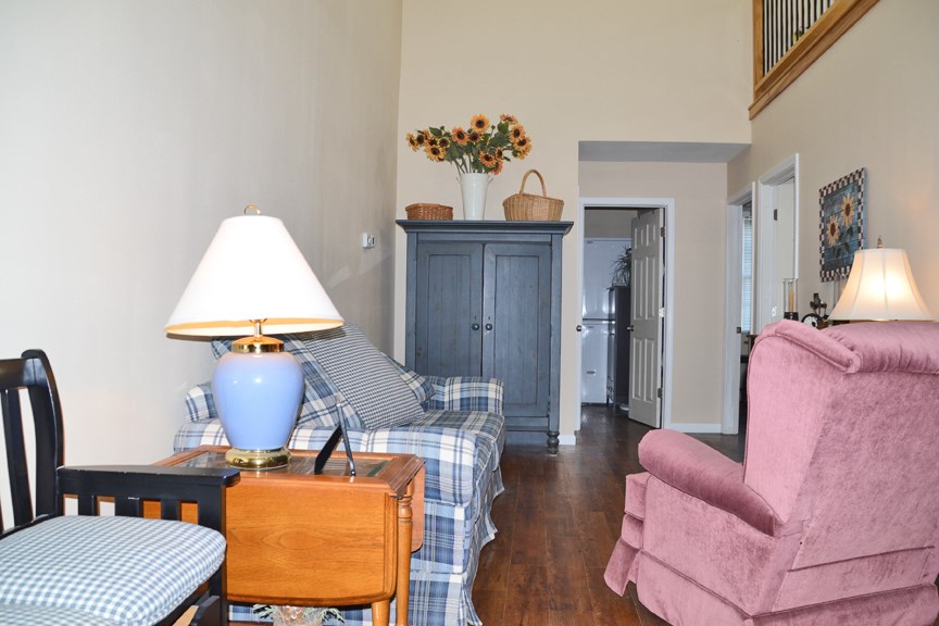 6727 Theodorff Road Pecatonica, IL 61063 - Photo 15 of 16 a living room with furniture and a lamp
