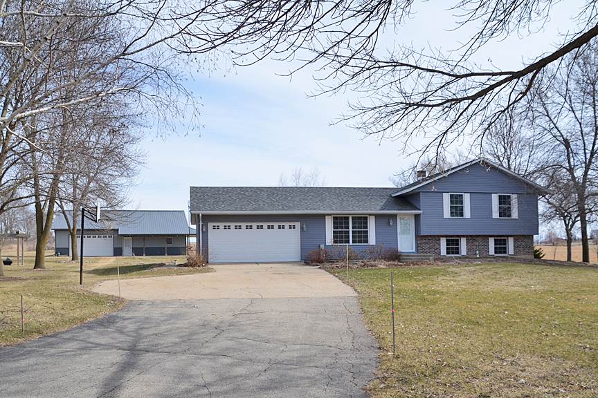 6727 Theodorff Road Pecatonica, IL 61063 - Photo 2 of 16 a front view of a house with a yard