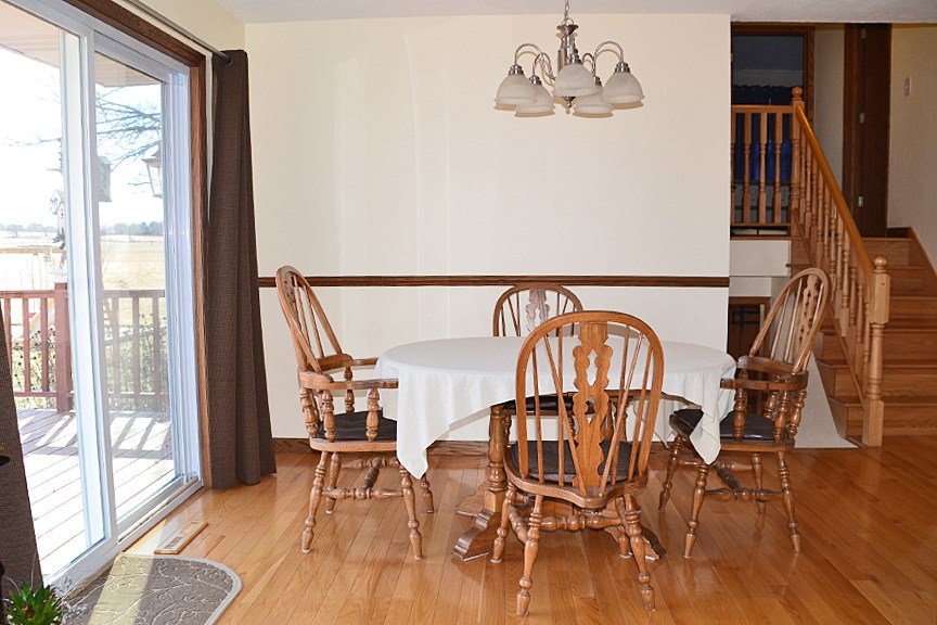 6727 Theodorff Road Pecatonica, IL 61063 - Photo 3 of 16 a view of dining room with furniture and wooden floor
