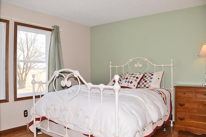 6727 Theodorff Road Pecatonica, IL 61063 - Photo 7 of 16 a bedroom with bed and a window