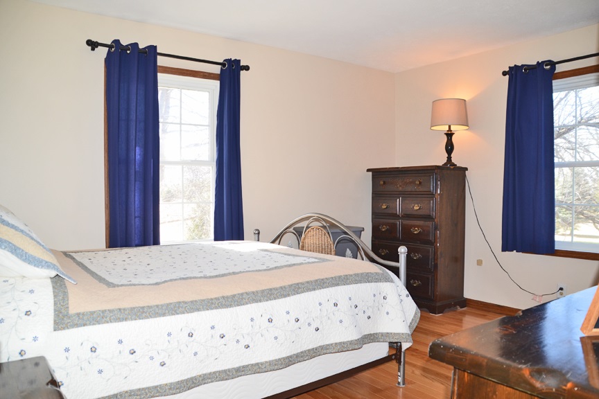6727 Theodorff Road Pecatonica, IL 61063 - Photo 8 of 16 a bedroom with a bed and a window