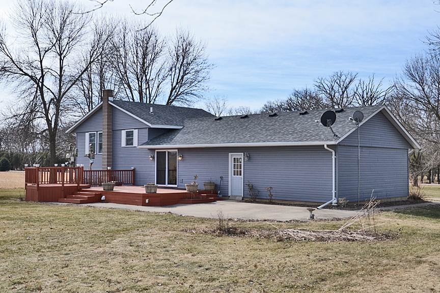 6727 Theodorff Road Pecatonica, IL 61063 - Photo 10 of 16 a front view of a house with a yard