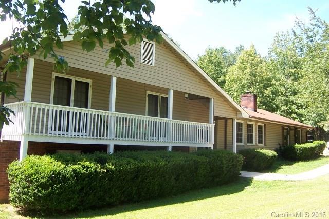 2316 Golf Course Road, Unit P8871 & P88151 Columbus, NC 28722 - Photo 1 of 21 a view of a house with a yard and plants