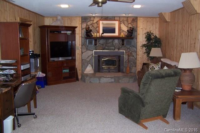 2316 Golf Course Road, Unit P8871 & P88151 Columbus, NC 28722 - Photo 14 of 21 a living room with furniture and a flat screen tv