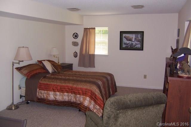 2316 Golf Course Road, Unit P8871 & P88151 Columbus, NC 28722 - Photo 19 of 21 a bedroom with a bed and window