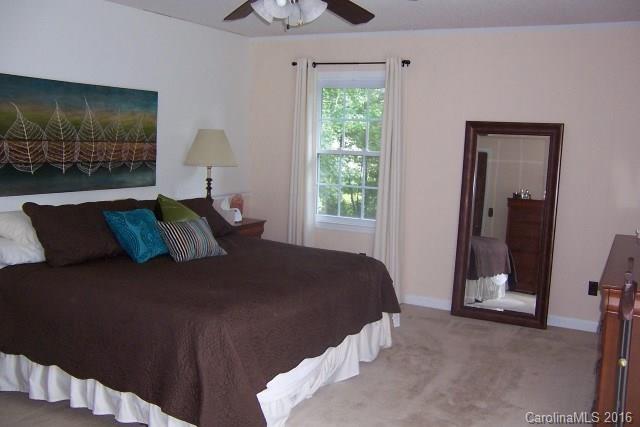 2316 Golf Course Road, Unit P8871 & P88151 Columbus, NC 28722 - Photo 20 of 21 a bed sitting in a bedroom next to a window