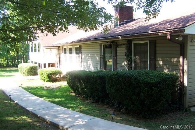 2316 Golf Course Road, Unit P8871 & P88151 Columbus, NC 28722 - Photo 3 of 21 a front view of a house with a garden