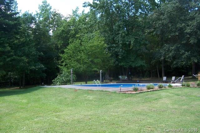2316 Golf Course Road, Unit P8871 & P88151 Columbus, NC 28722 - Photo 10 of 21 a view of a garden with houses