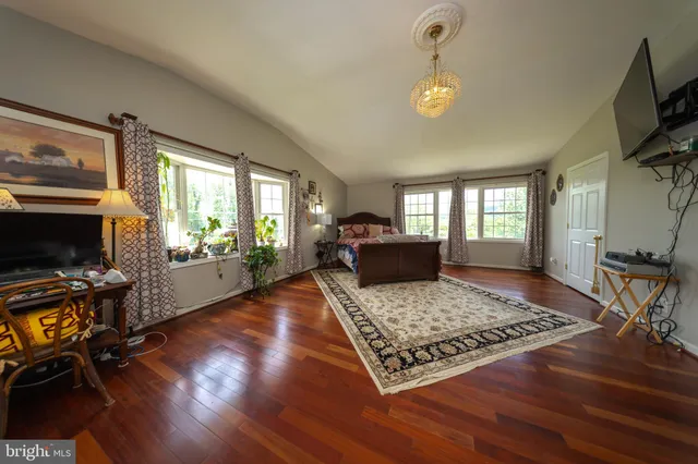 a room with furniture and wooden floor