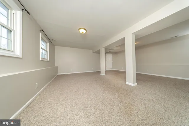 a view of a city with lush green forest