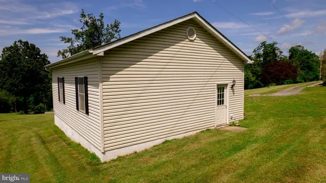a front view of a house with swimming pool