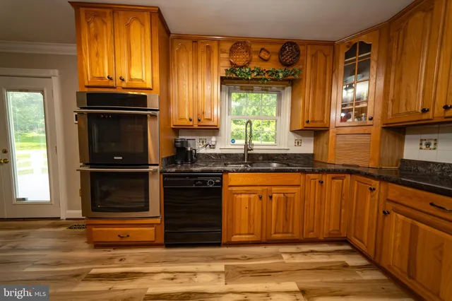 a living room with furniture rug and window