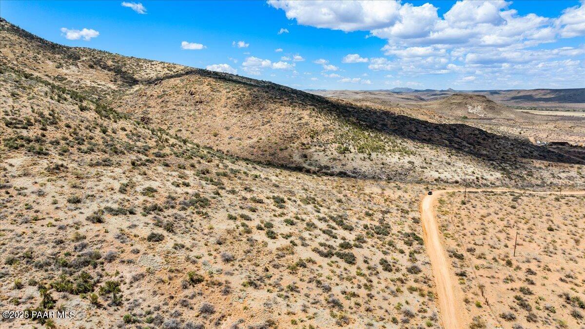 0 West Well Springs Road Skull Valley, AZ 86338 - Photo 18 of 24 a view of a large building with mountains in the background