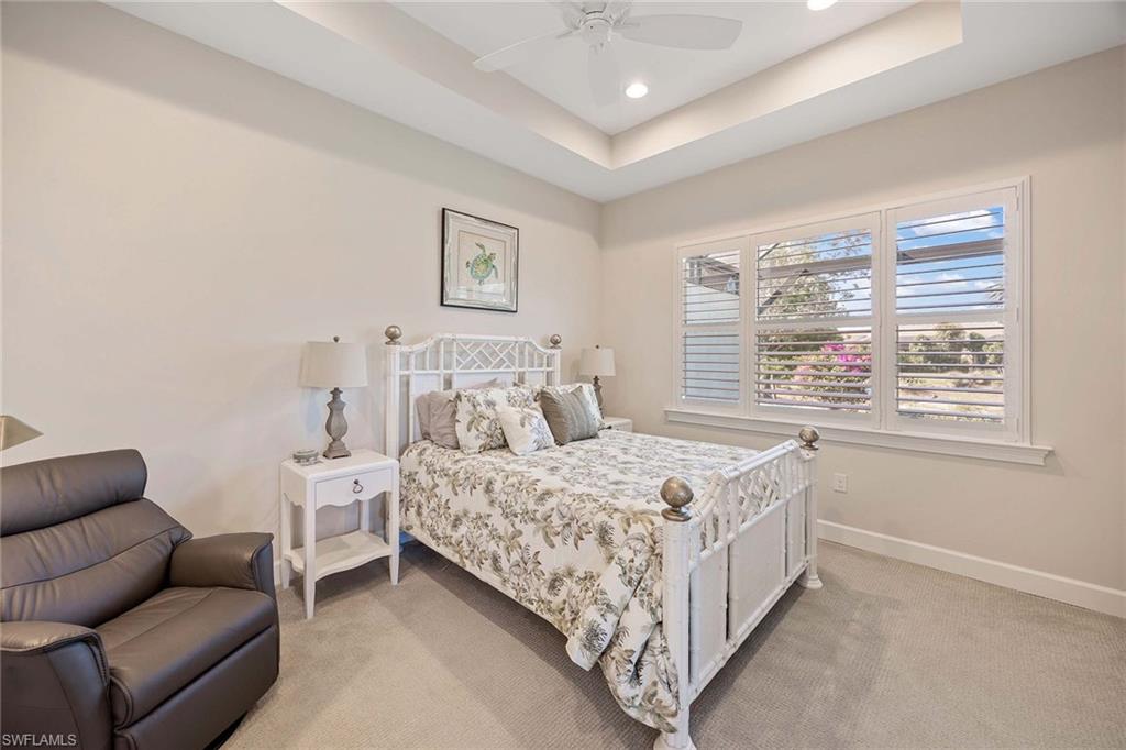 5626 Elbow Avenue Naples, FL 34113 - Photo 17 of 48 a bed room with a bed and a couch