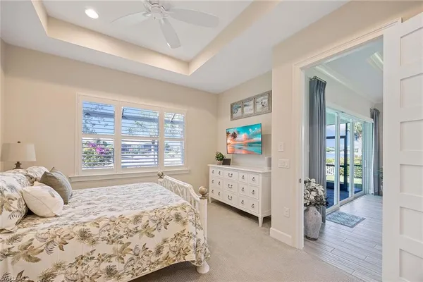 a bedroom with bed and window