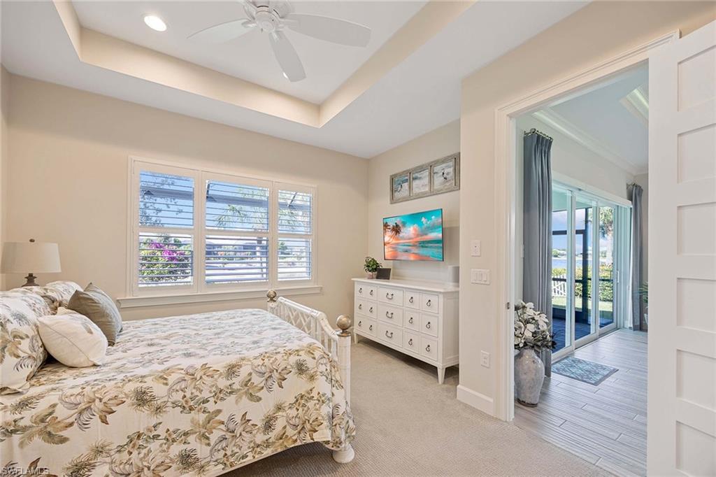 5626 Elbow Avenue Naples, FL 34113 - Photo 18 of 48 a bedroom with bed and window