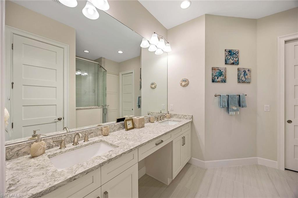 5626 Elbow Avenue Naples, FL 34113 - Photo 19 of 48 a bathroom with a granite countertop sink mirror and double