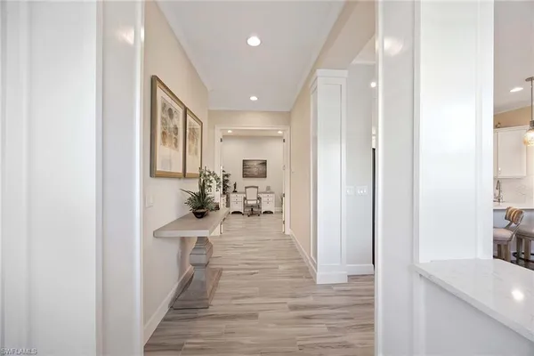 a view of a kitchen from the hallway