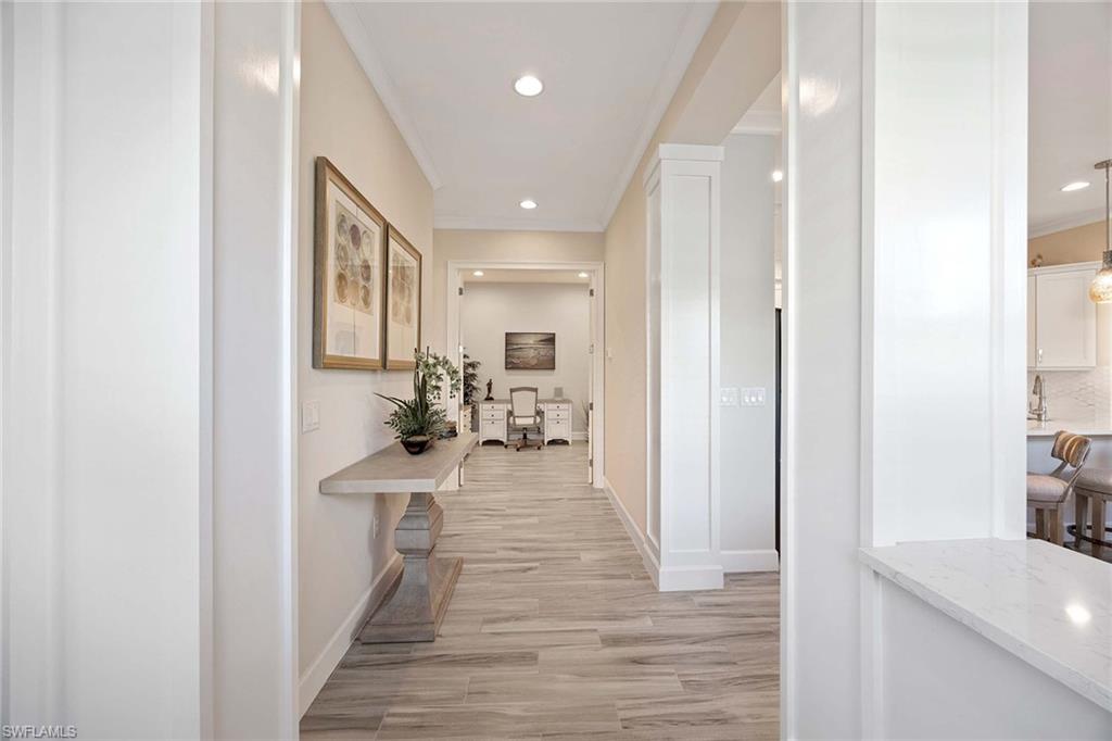 5626 Elbow Avenue Naples, FL 34113 - Photo 21 of 48 a view of a kitchen from the hallway
