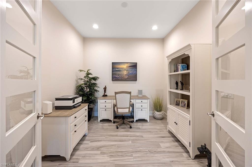 5626 Elbow Avenue Naples, FL 34113 - Photo 23 of 48 a view of living room with furniture and wooden floor