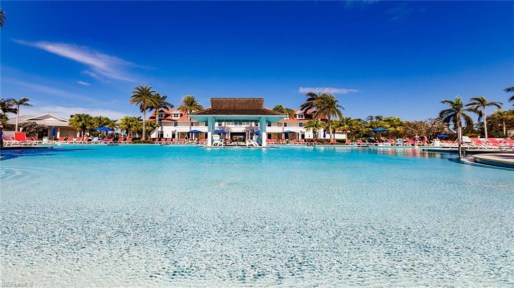 5626 Elbow Avenue Naples, FL 34113 - Photo 41 of 48 a group of people sitting in a backyard