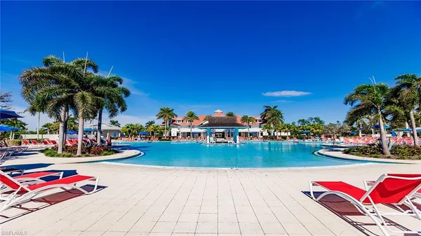 a view of swimming pool with outdoor seating