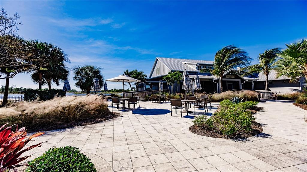 5626 Elbow Avenue Naples, FL 34113 - Photo 44 of 48 a view of a patio with swimming pool