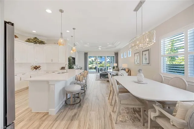 a large kitchen with a table and chairs