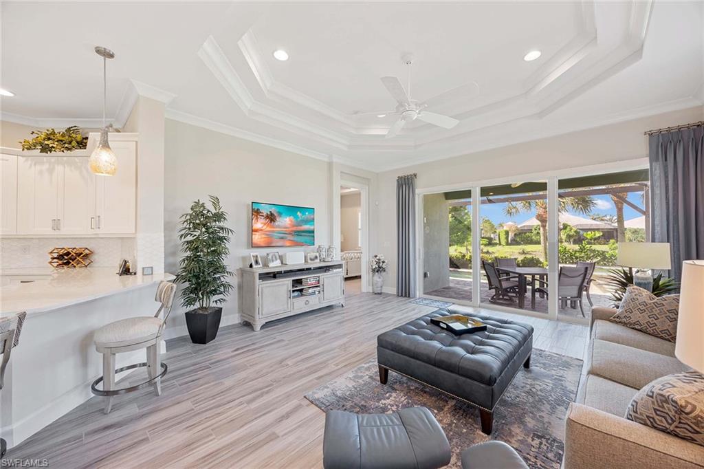 5626 Elbow Avenue Naples, FL 34113 - Photo 8 of 48 a living room with furniture and a large window