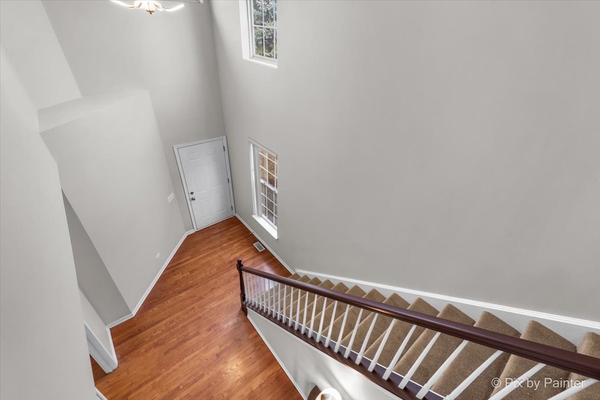 486 Vaughn Circle Aurora, IL 60502 - Photo 13 of 40 a view of balcony with wooden floor