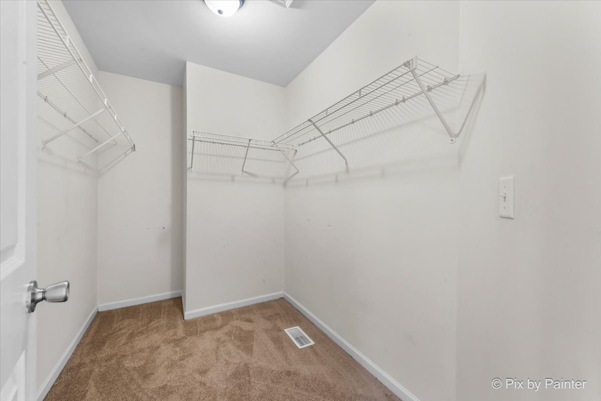 486 Vaughn Circle Aurora, IL 60502 - Photo 19 of 40 a view of a room with racks on the wall