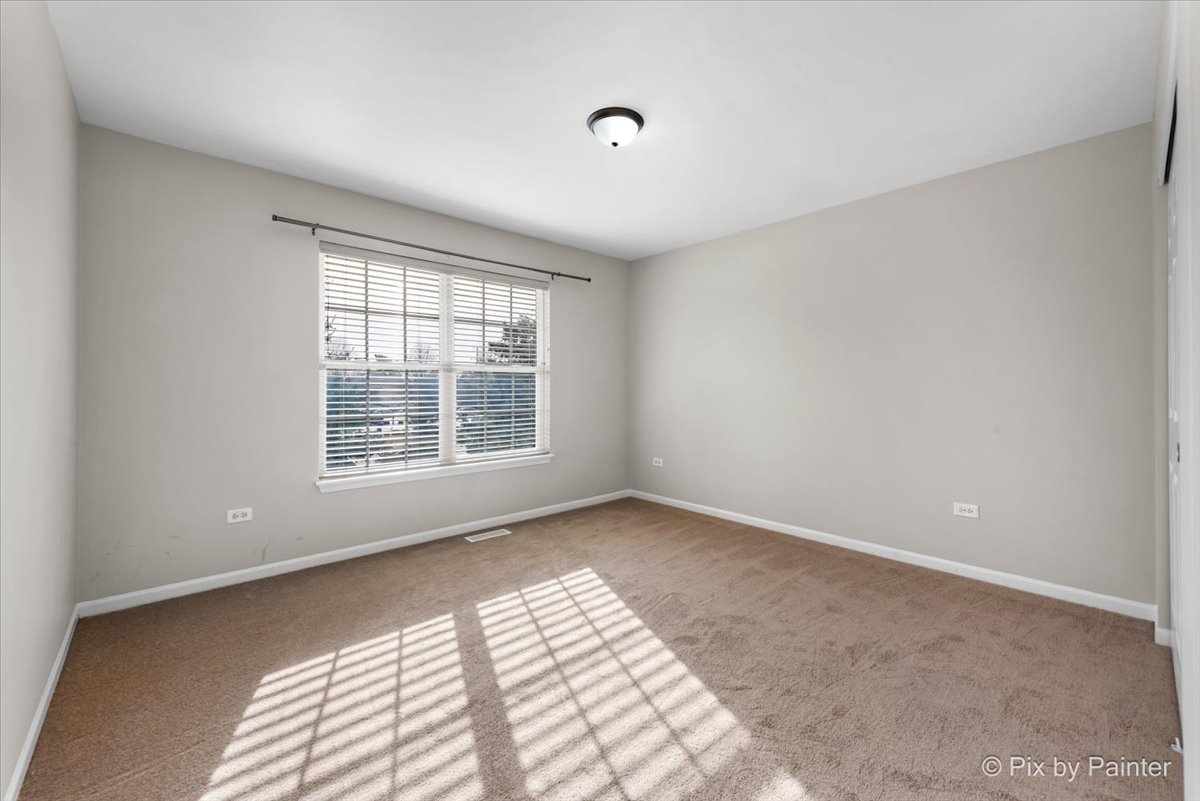486 Vaughn Circle Aurora, IL 60502 - Photo 20 of 40 a view of an empty room with a window