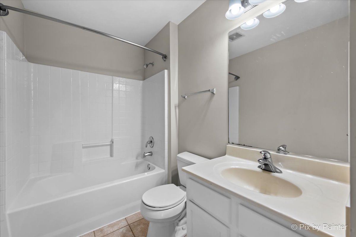 486 Vaughn Circle Aurora, IL 60502 - Photo 24 of 40 a bathroom with a sink toilet and shower