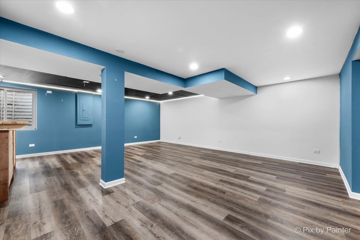 486 Vaughn Circle Aurora, IL 60502 - Photo 25 of 40 a view of empty room with wooden floor